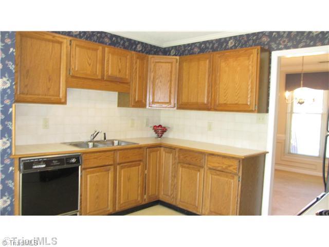 8021 Linville Road Oak Ridge, NC 27310 - Photo 6 of 16 Kitchen. Lots of cabinet storage in this eat in kitchen
