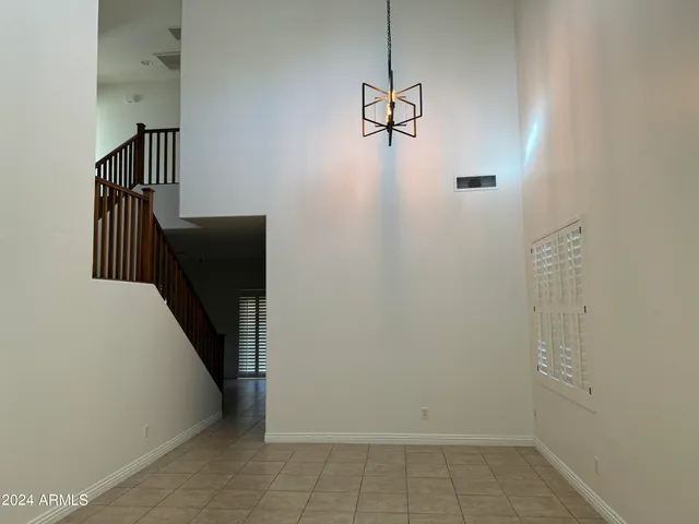 a view of a storage & utility room with stairs
