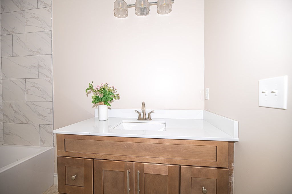 10 Meadowview Lane, Unit B Salisbury, MA 01952 - Photo 10 of 31 a bathroom with a sink and a bathtub