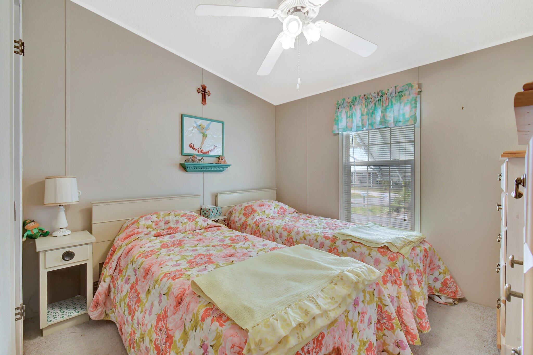 14567 Sunset Drive Delray Beach, FL 33445 - Photo 21 of 32 a bedroom with a bed and a painting on the wall