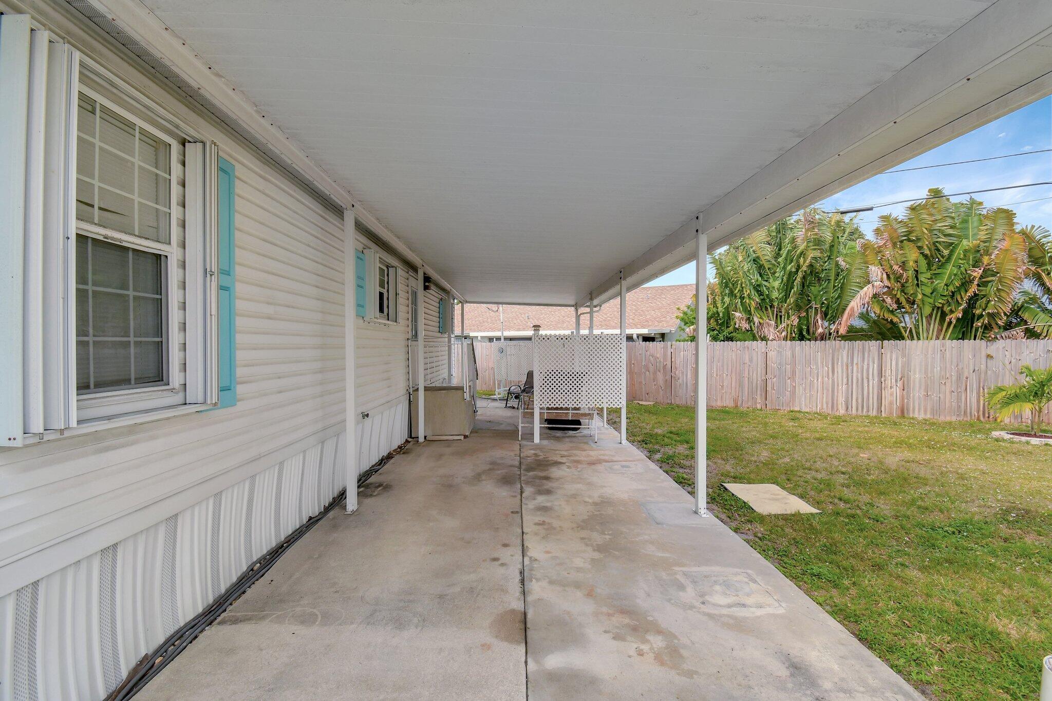 14567 Sunset Drive Delray Beach, FL 33445 - Photo 5 of 32 a view of a back yard of the house