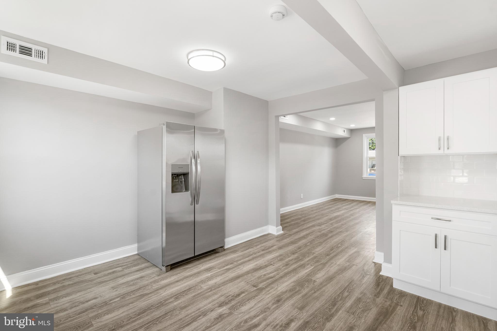 1263 Neighbors Avenue Baltimore, MD 21237 - Photo 12 of 33 a view of an empty room and wooden floor