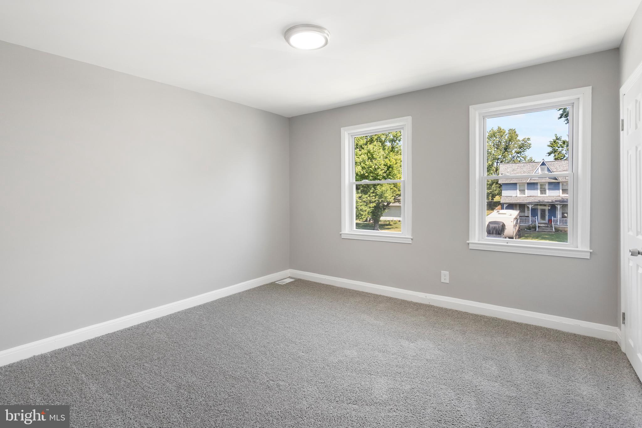 1263 Neighbors Avenue Baltimore, MD 21237 - Photo 15 of 33 an empty room with windows