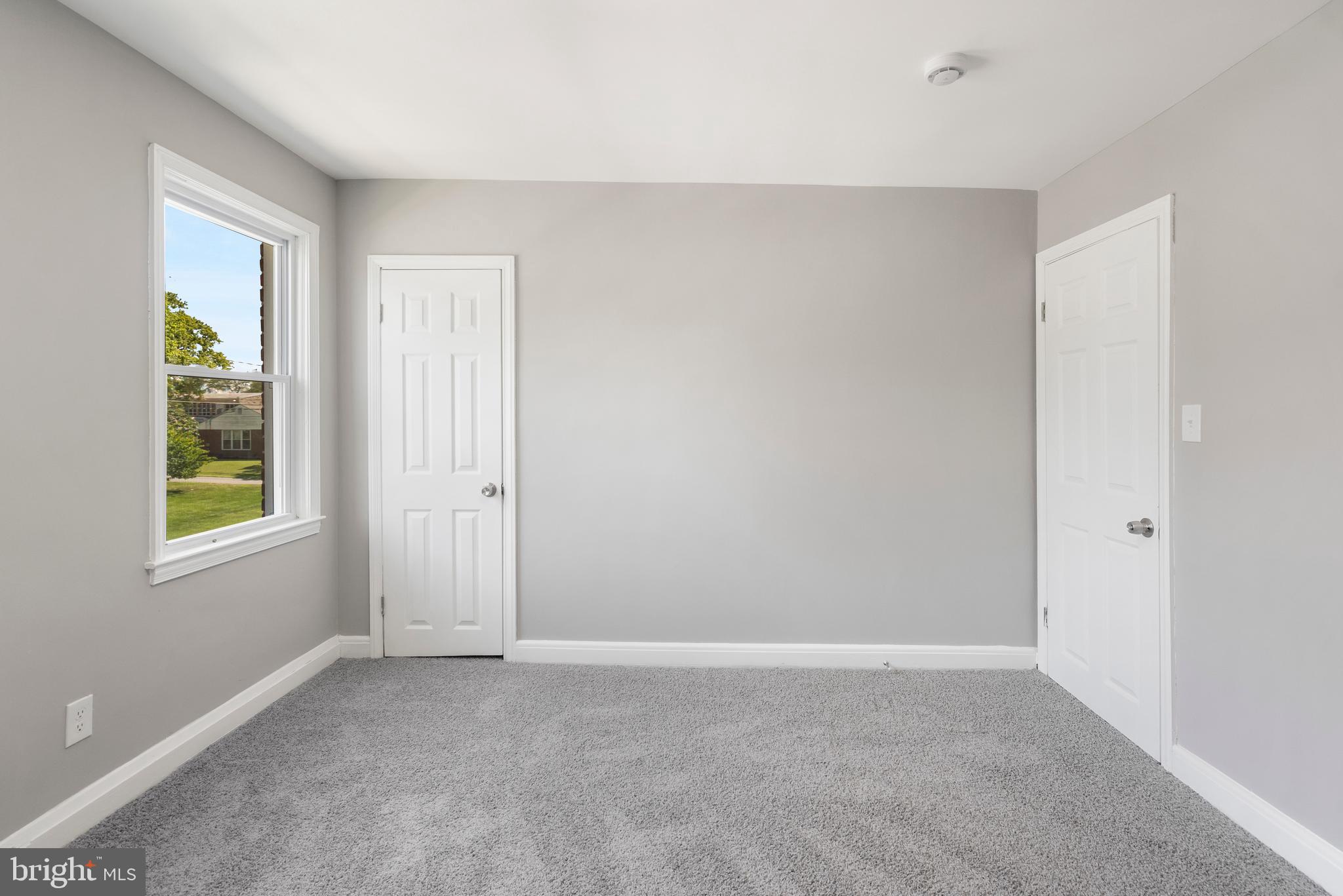 1263 Neighbors Avenue Baltimore, MD 21237 - Photo 17 of 33 an empty room with windows