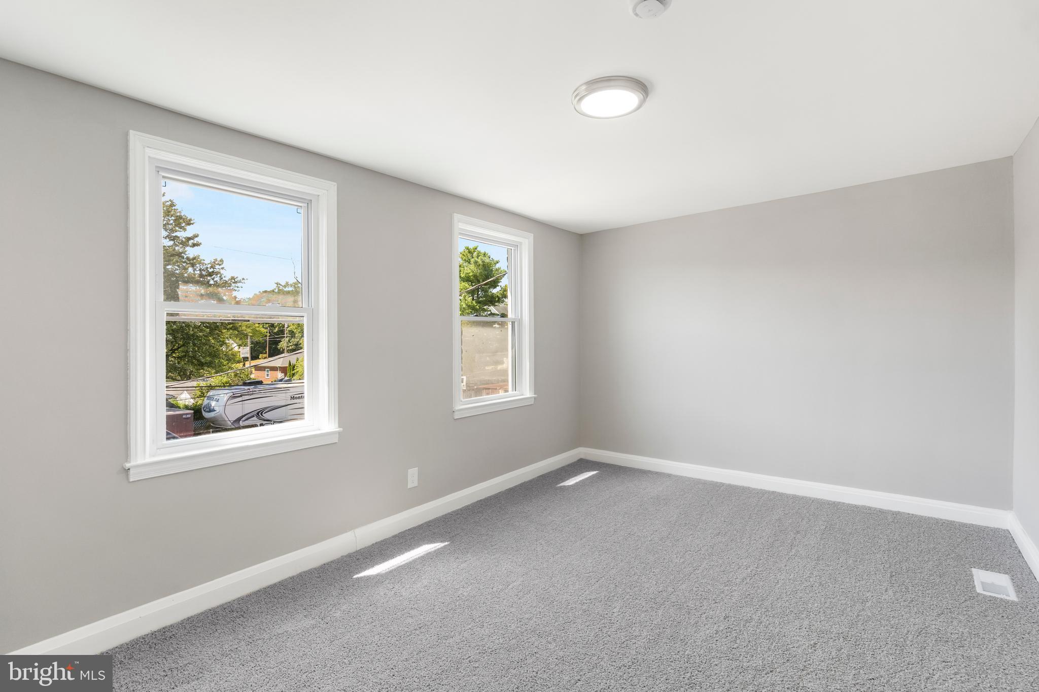 1263 Neighbors Avenue Baltimore, MD 21237 - Photo 18 of 33 an empty room with windows