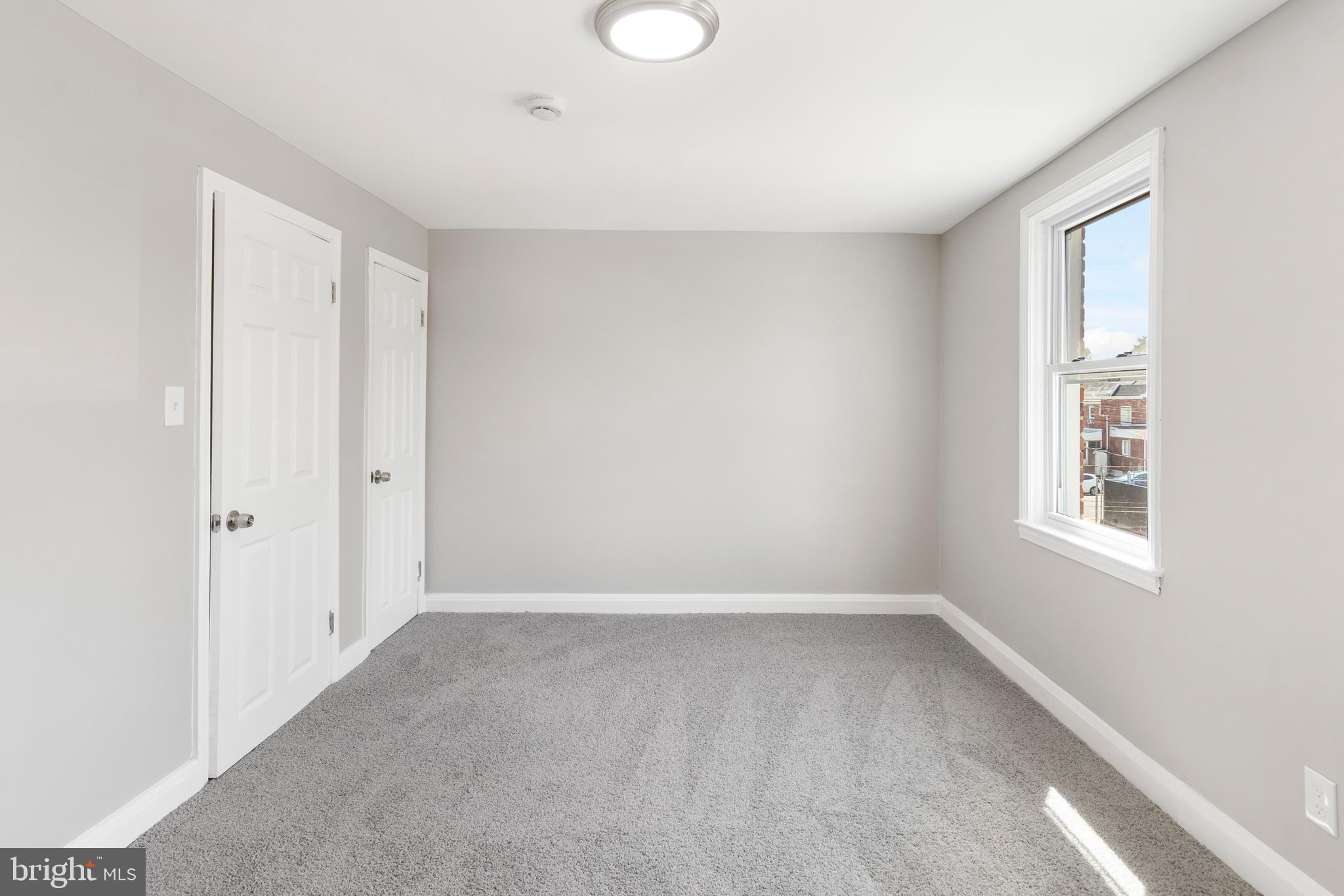 1263 Neighbors Avenue Baltimore, MD 21237 - Photo 19 of 33 a view of an empty room with a window