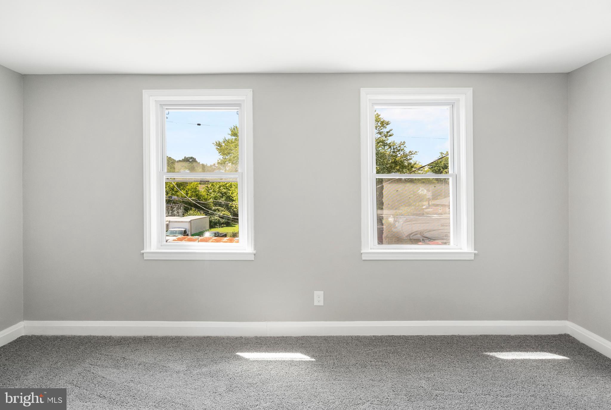 1263 Neighbors Avenue Baltimore, MD 21237 - Photo 20 of 33 an empty room with windows