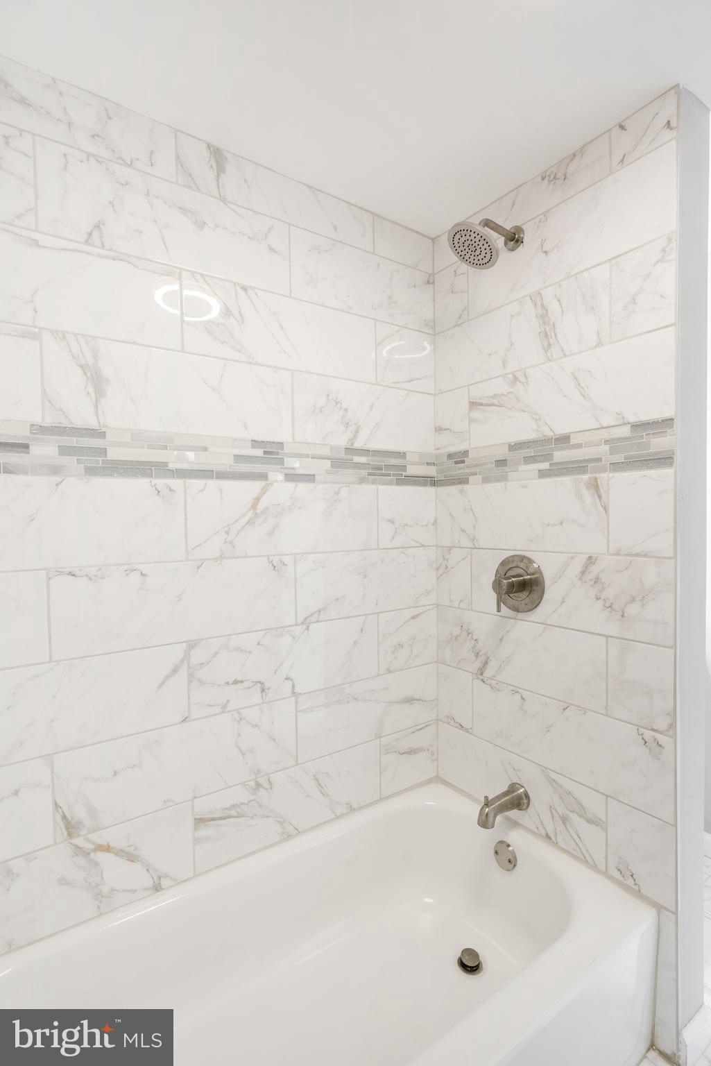 1263 Neighbors Avenue Baltimore, MD 21237 - Photo 22 of 33 a bathroom with a sink and a shower