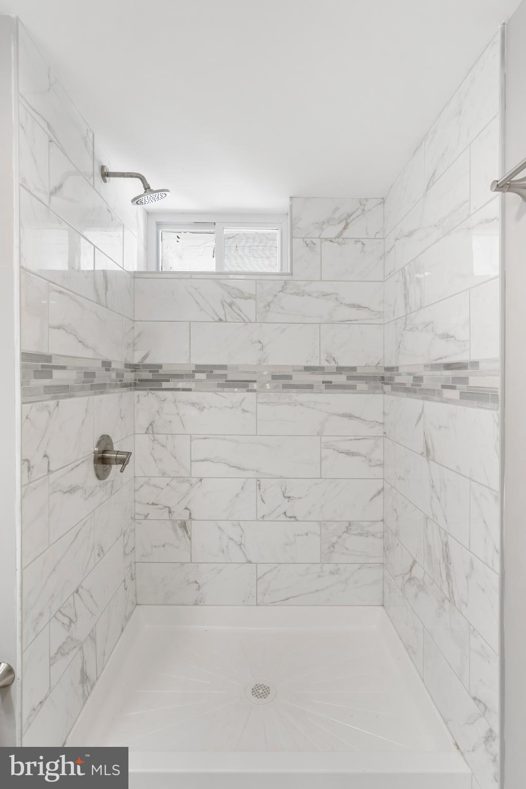 1263 Neighbors Avenue Baltimore, MD 21237 - Photo 28 of 33 a bathroom with a shower