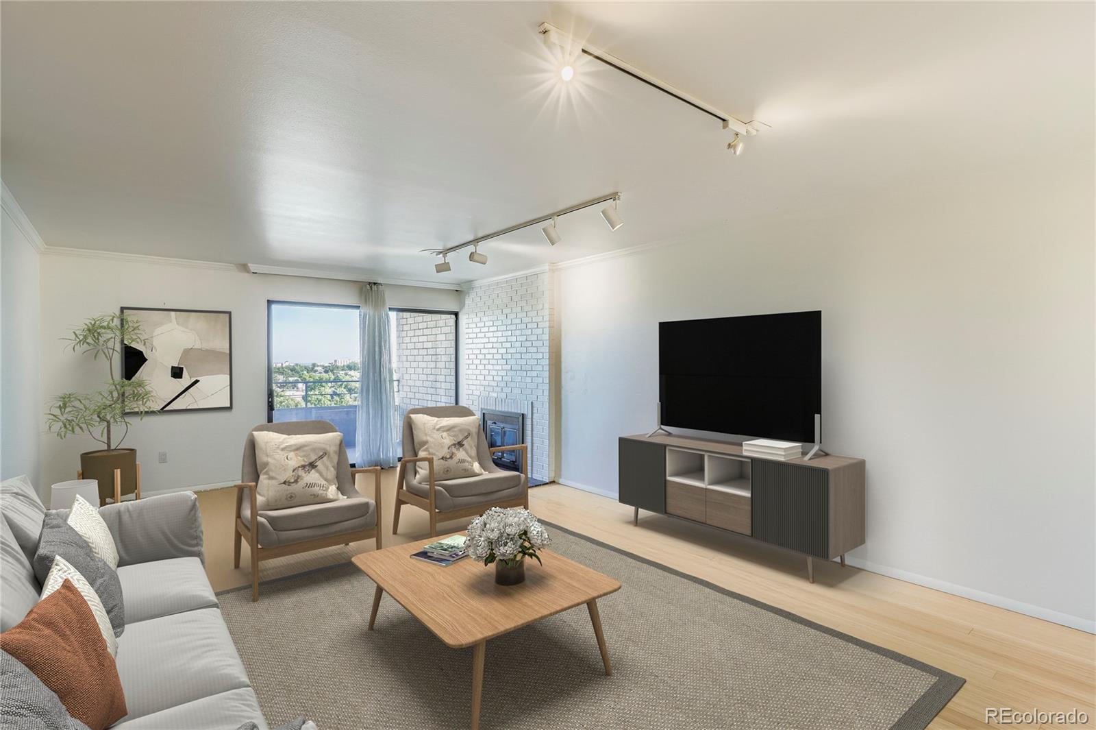 a living room with furniture a flat screen tv a rug and a window