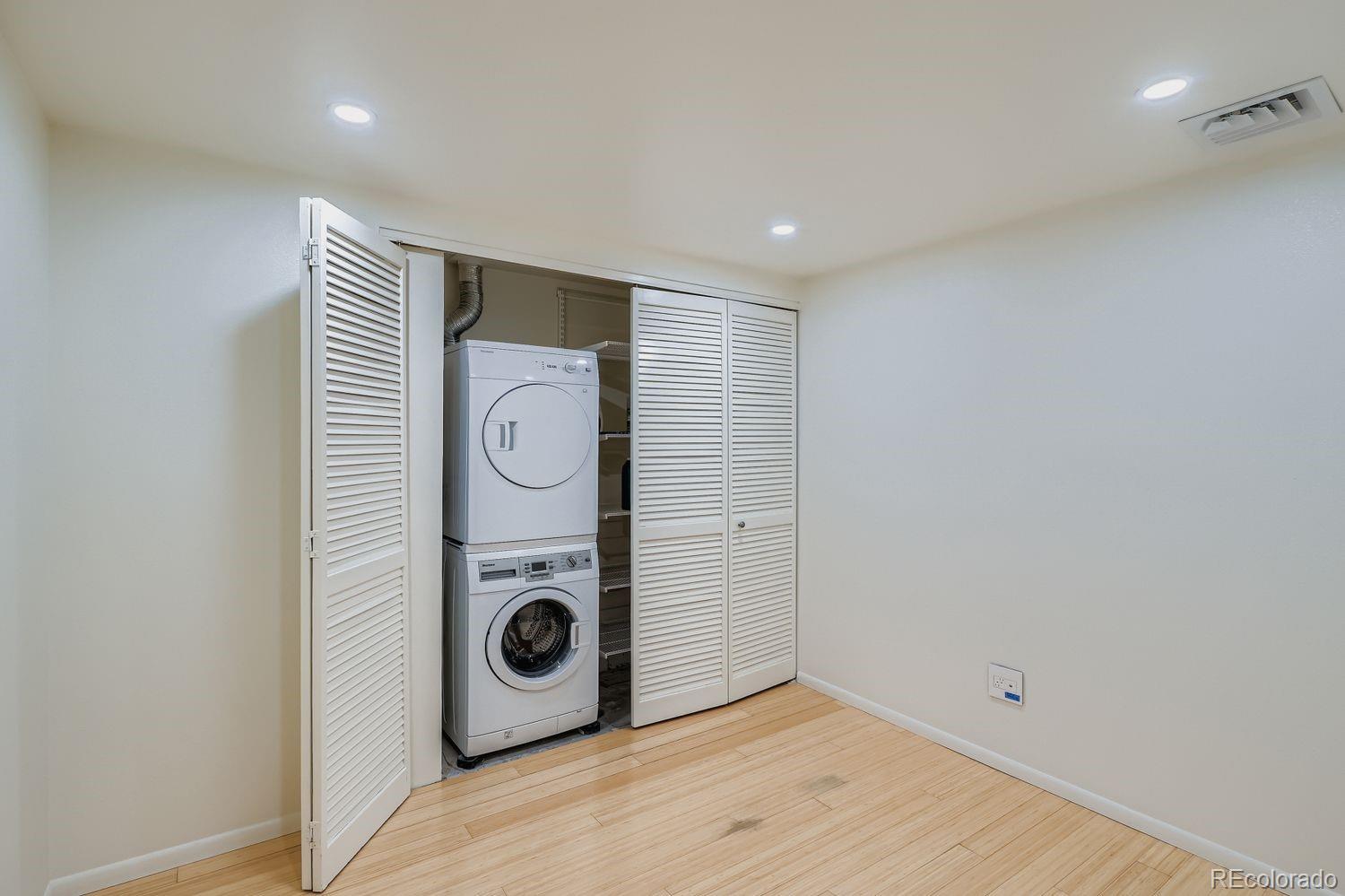 800 Pearl Street, Unit 809 Denver, CO 80203 - Photo 5 of 15 a view of a storage & utility room with washer and dryer