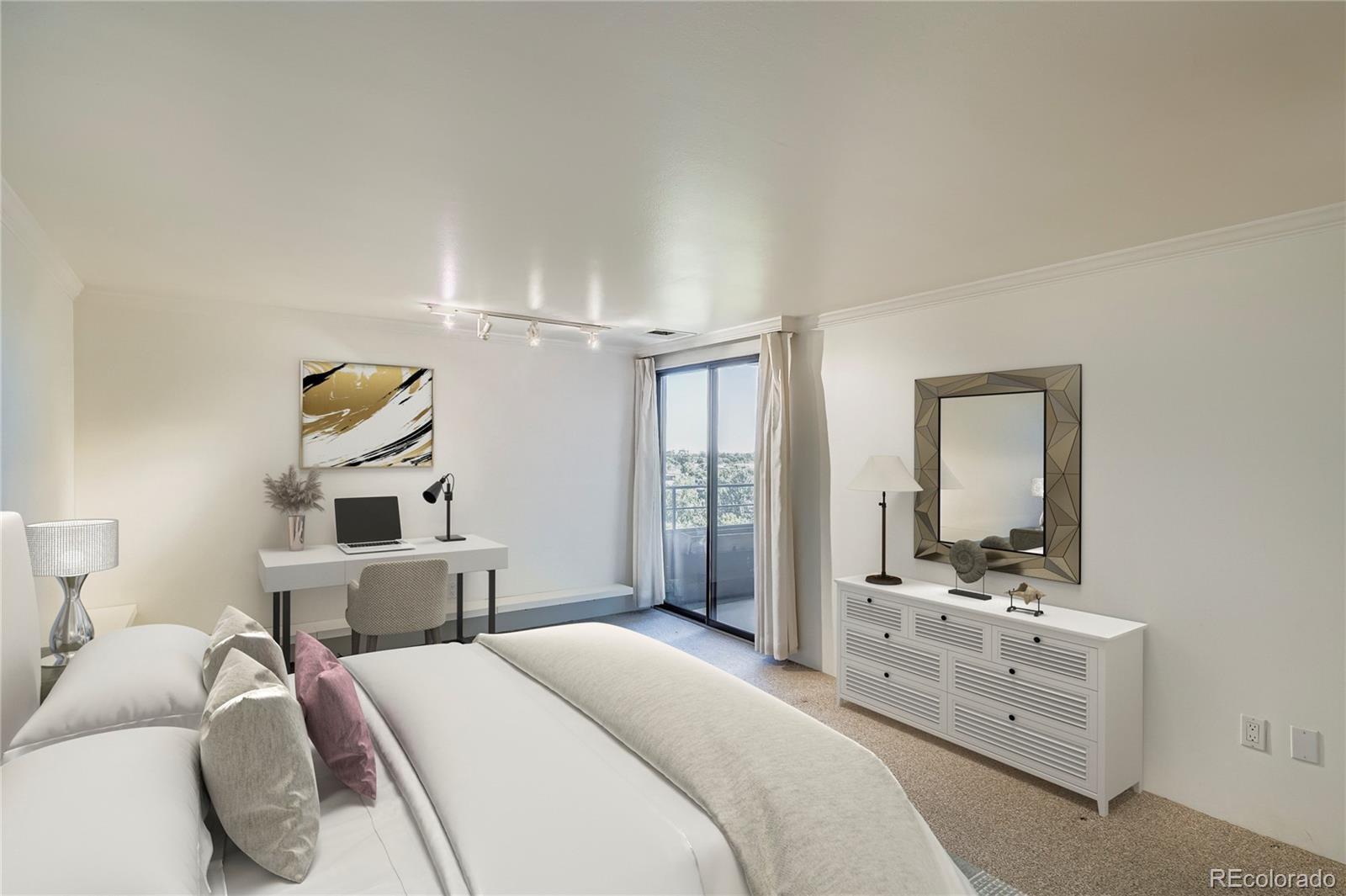 800 Pearl Street, Unit 809 Denver, CO 80203 - Photo 6 of 15 a bedroom with a bed and a large mirror