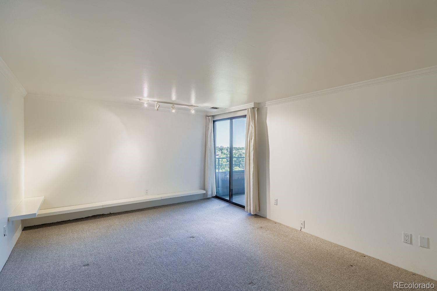 800 Pearl Street, Unit 809 Denver, CO 80203 - Photo 7 of 15 an empty room with entrance and windows