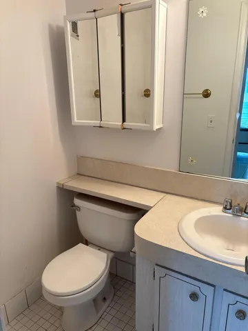 a room with furniture and a chandelier fan