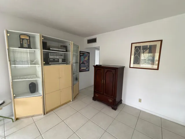 a view of a dining room with furniture and window