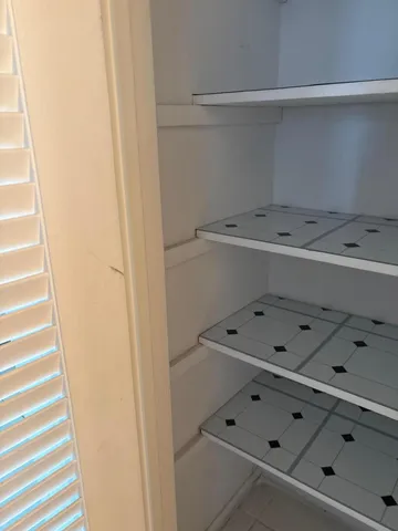 a view of wooden floor and chair in a room
