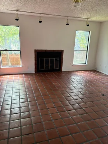 a view of empty room with windows