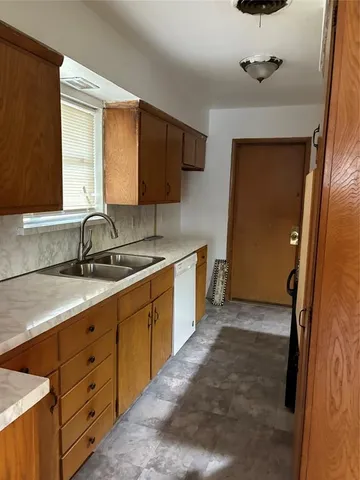 a bathroom with a sink double vanity and a mirror