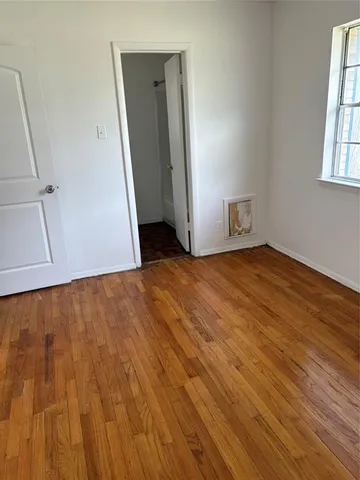 a view of an empty room with windows