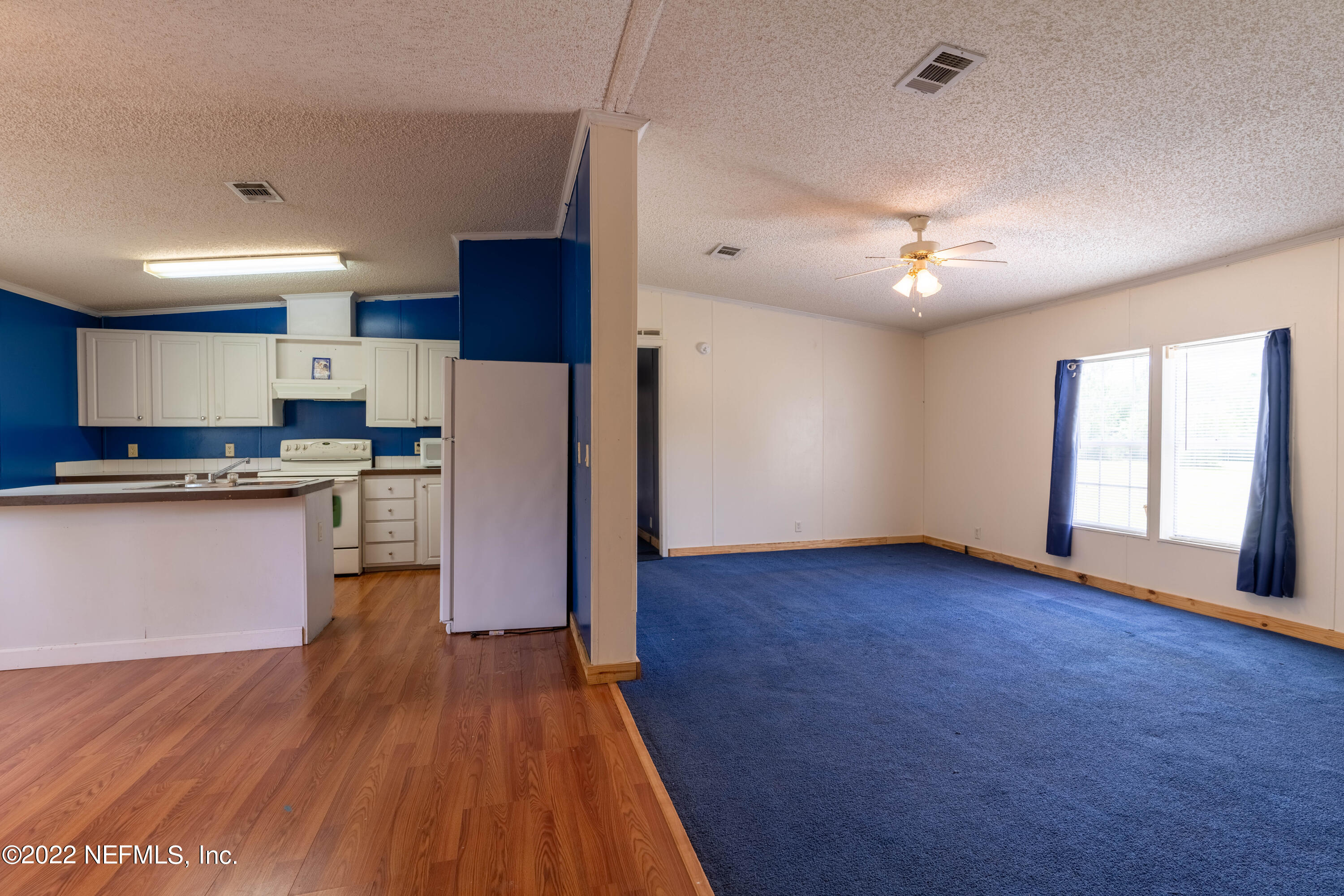 19697 Crews Road Glen St. Mary, FL 32040 - Photo 14 of 25 a kitchen with a refrigerator and a stove top oven