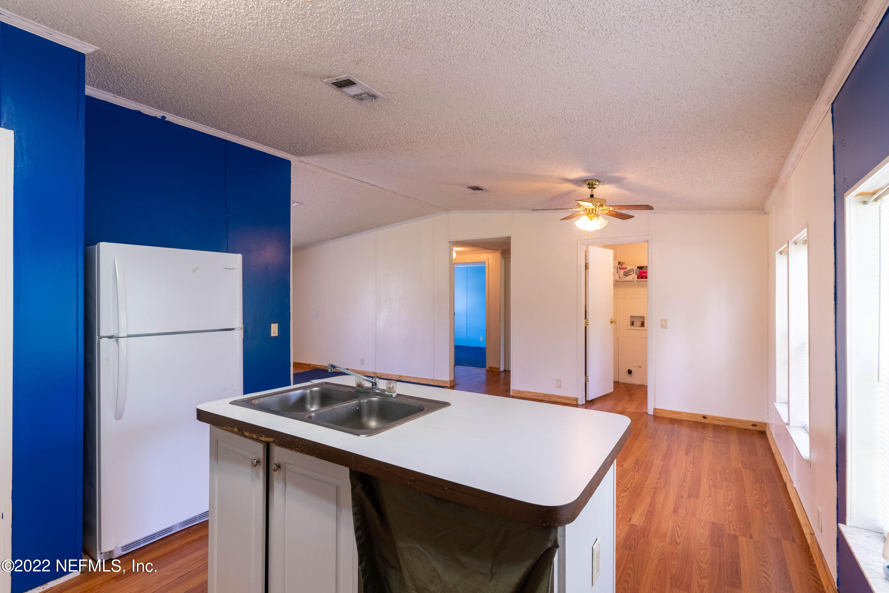 19697 Crews Road Glen St. Mary, FL 32040 - Photo 16 of 25 a kitchen that has a sink and a refrigerator