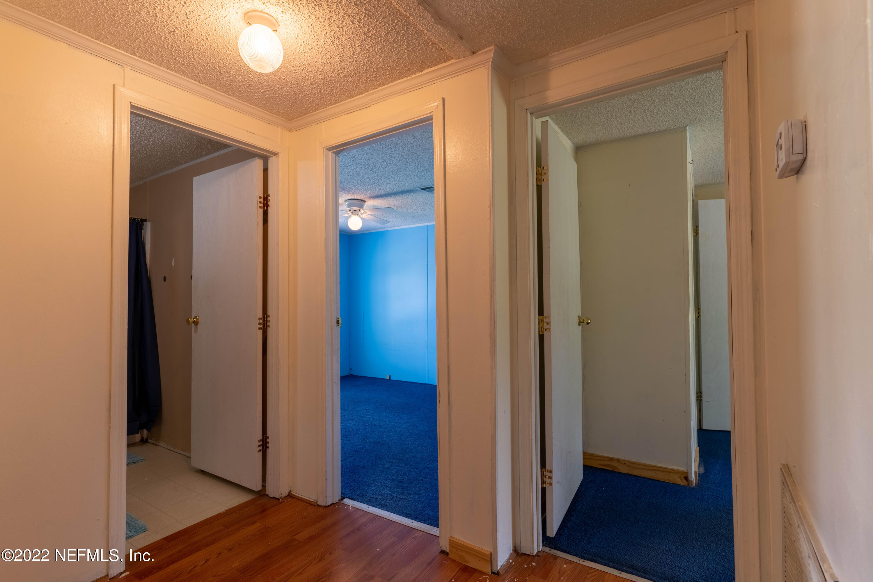 19697 Crews Road Glen St. Mary, FL 32040 - Photo 17 of 25 a view of a hallway with wooden floor