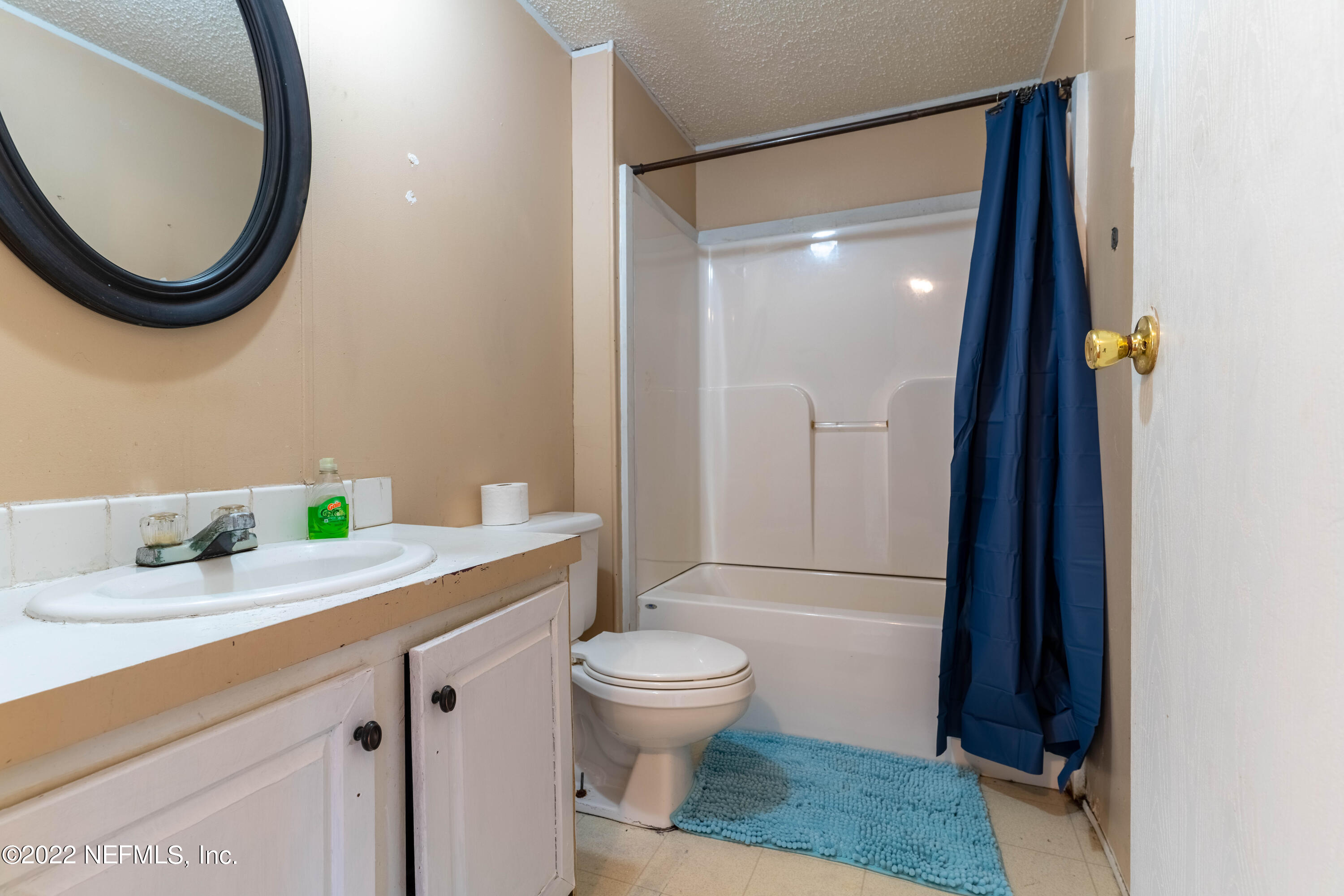 19697 Crews Road Glen St. Mary, FL 32040 - Photo 18 of 25 a bathroom with a granite countertop toilet sink and mirror