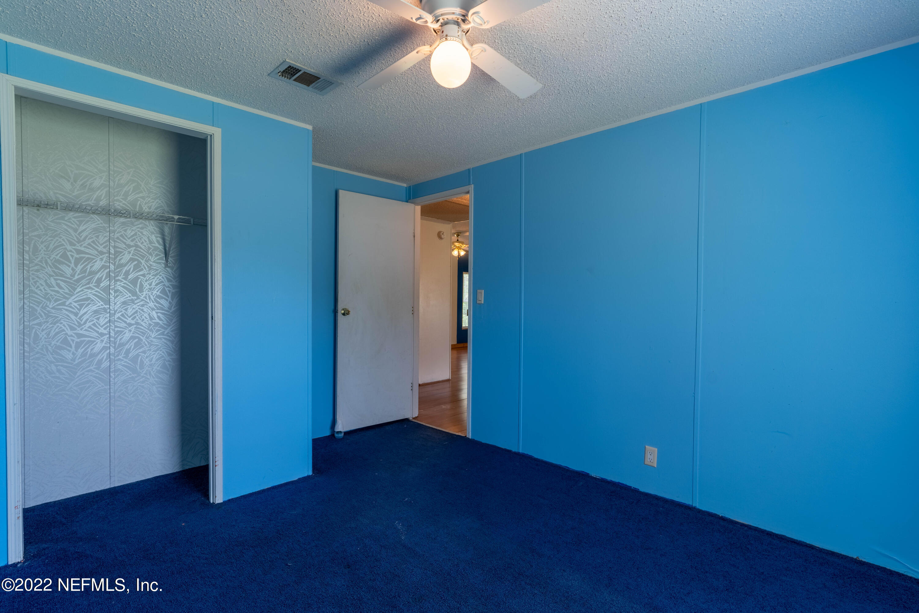 19697 Crews Road Glen St. Mary, FL 32040 - Photo 20 of 25 an empty room with wooden floor and windows