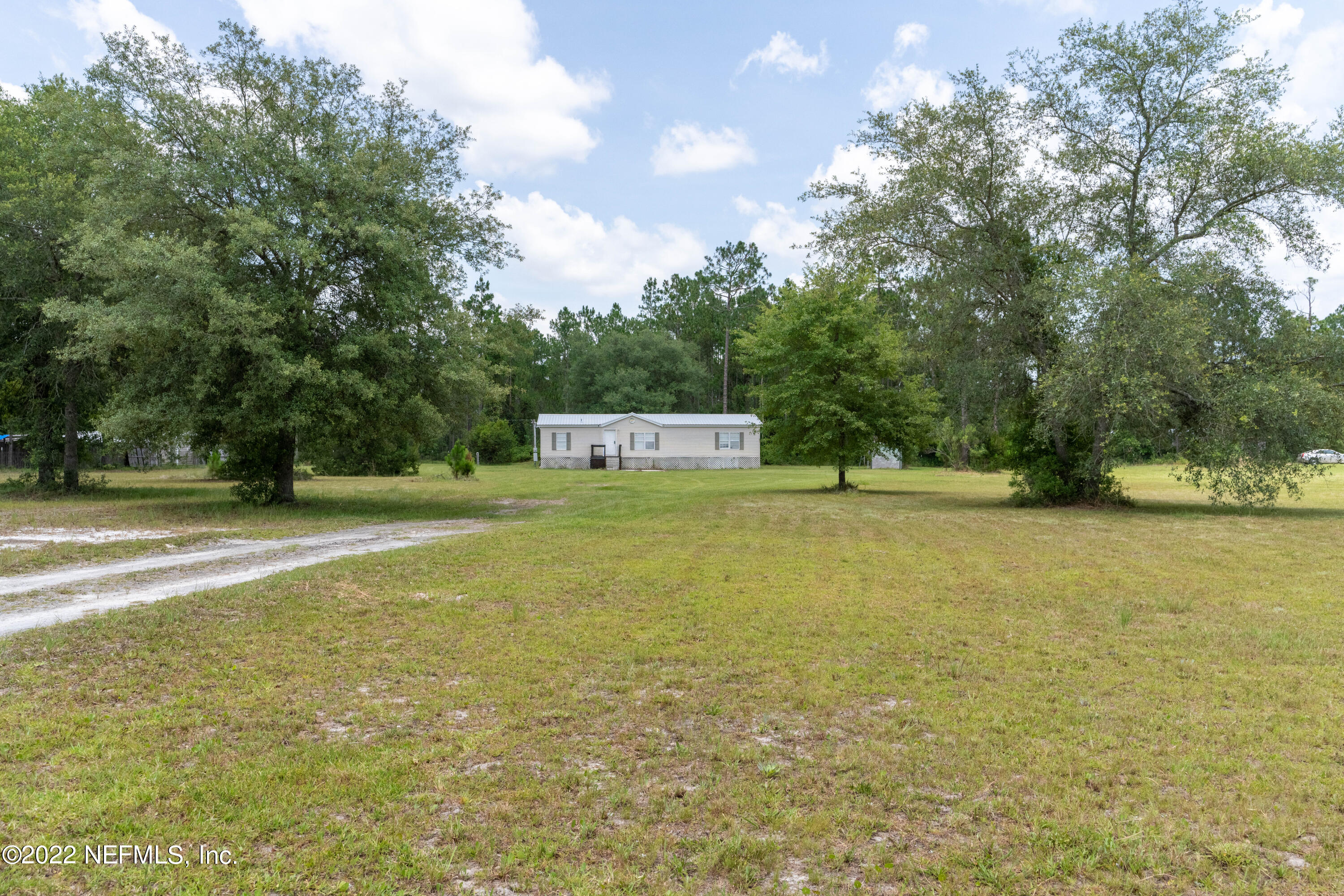 19697 Crews Road Glen St. Mary, FL 32040 - Photo 2 of 25 a view of a trees with yard