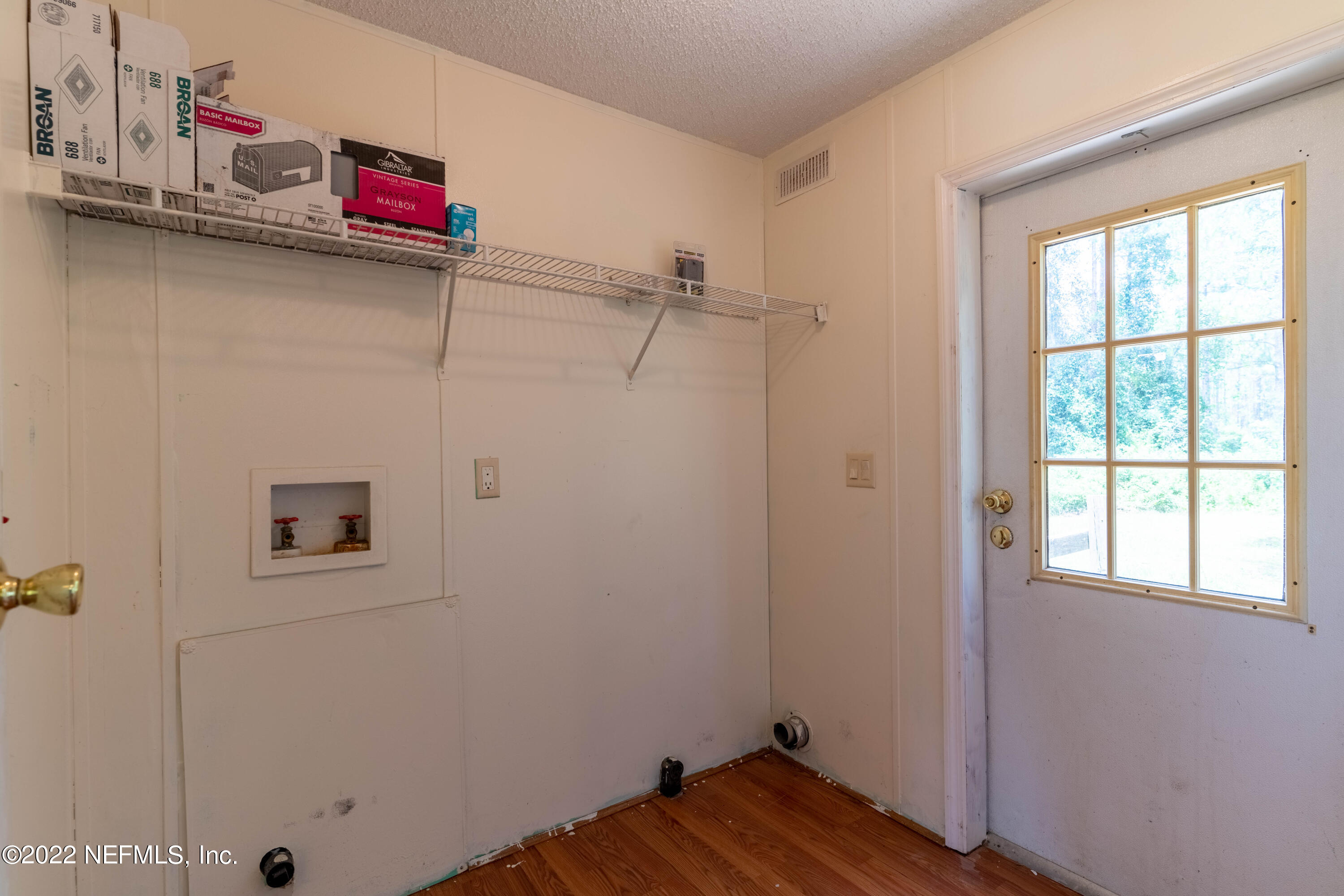 19697 Crews Road Glen St. Mary, FL 32040 - Photo 23 of 25 a view of a room with wooden floor and closet