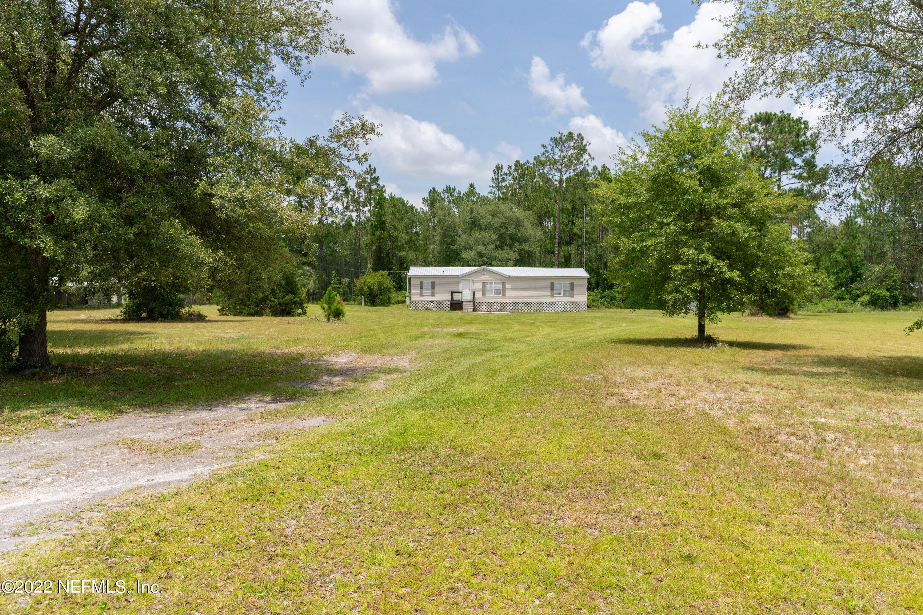 19697 Crews Road Glen St. Mary, FL 32040 - Photo 24 of 25 a view of a park with large trees