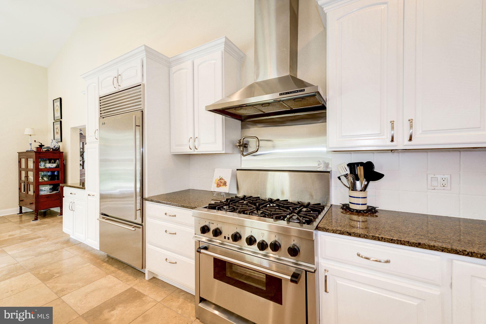 1018 Shipman Lane McLean, VA 22101 - Photo 11 of 30 a kitchen with stainless steel appliances granite countertop a stove and a refrigerator