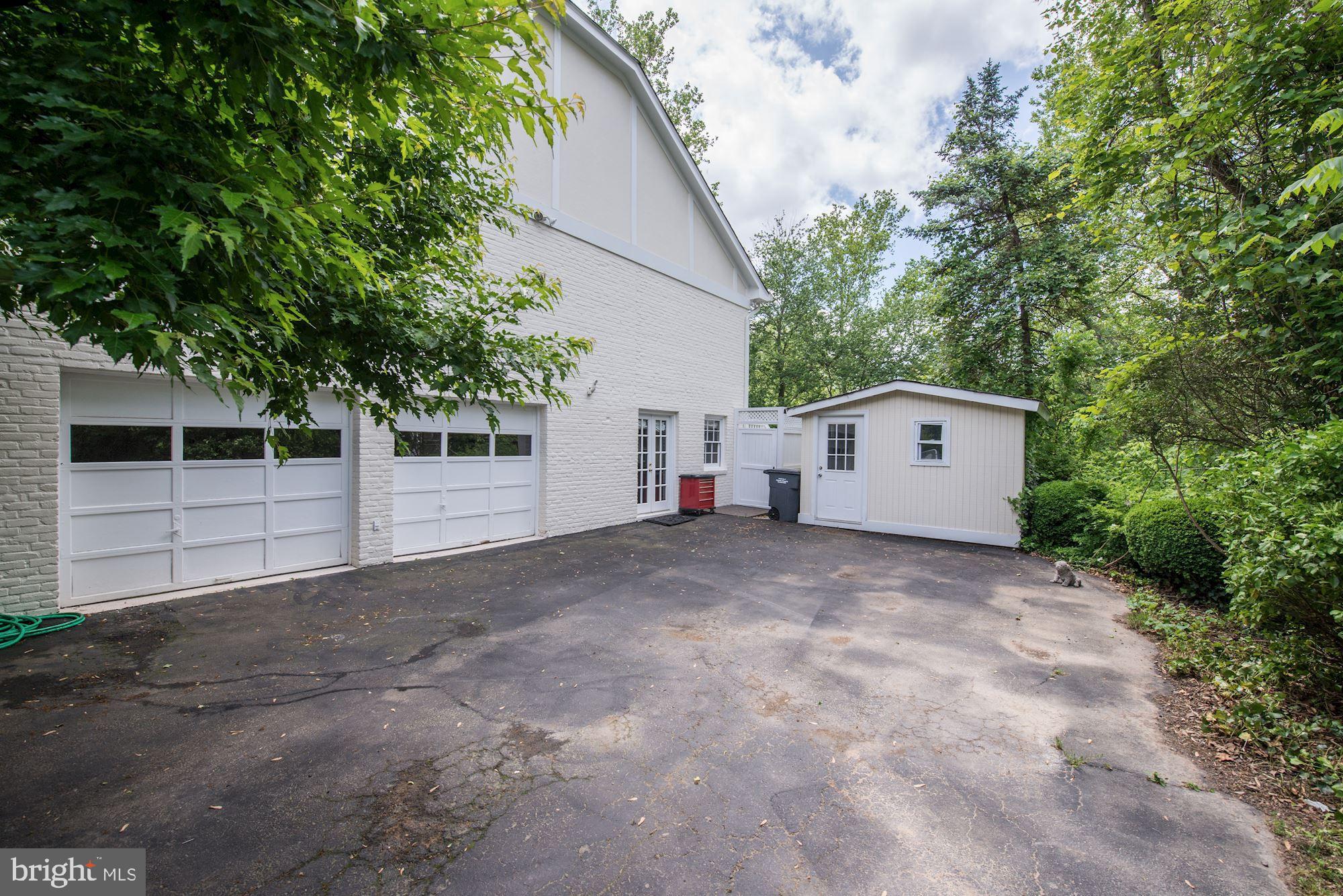 1018 Shipman Lane McLean, VA 22101 - Photo 28 of 30 a view of a house with a yard and garage