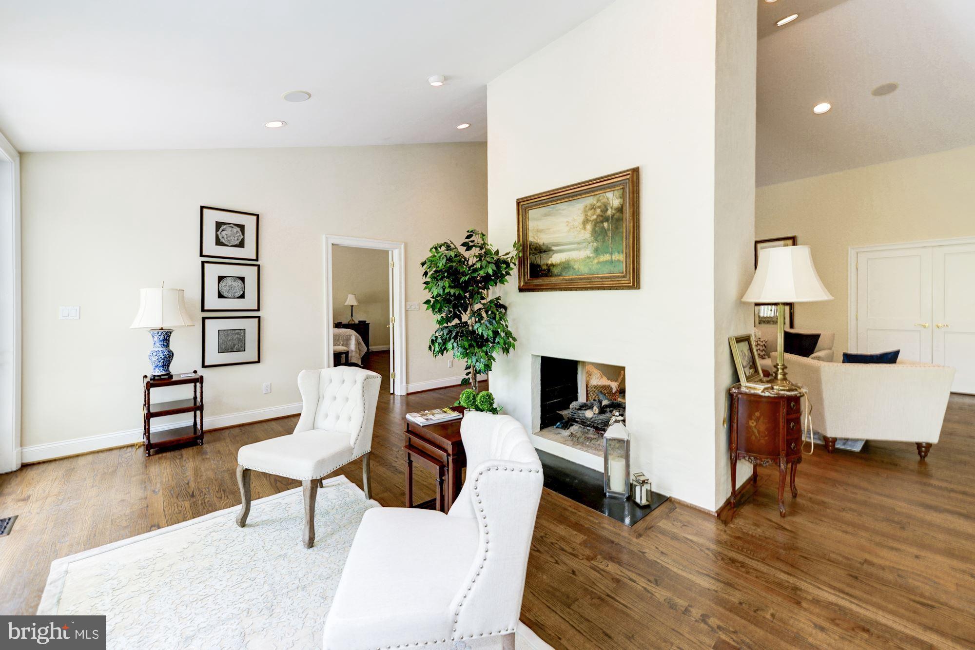 1018 Shipman Lane McLean, VA 22101 - Photo 5 of 30 a living room with furniture a fireplace and a flat screen tv
