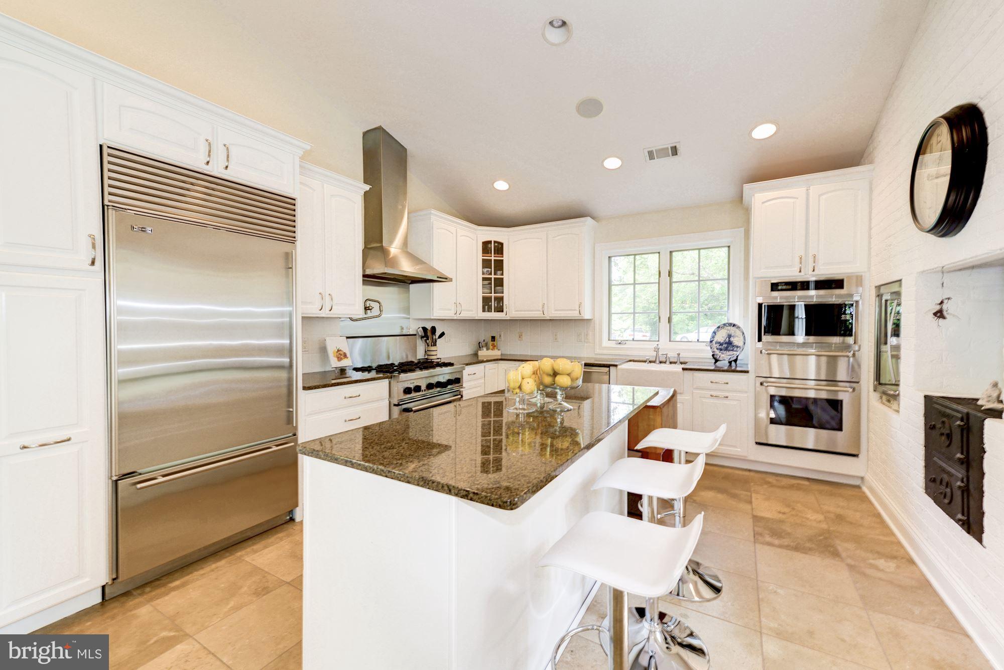 1018 Shipman Lane McLean, VA 22101 - Photo 10 of 30 a kitchen with stainless steel appliances granite countertop a refrigerator sink and cabinets
