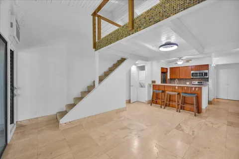 a view of a hallway with seating space