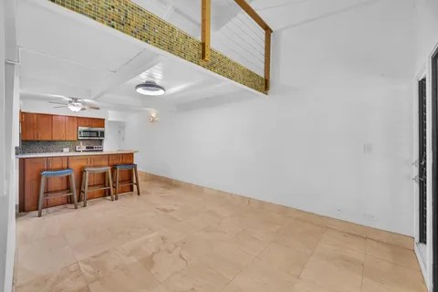 a view of a kitchen with furniture and a window