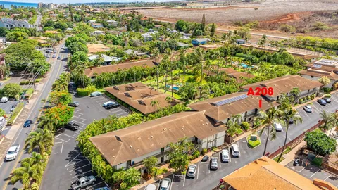 an aerial view of a residential houses with street