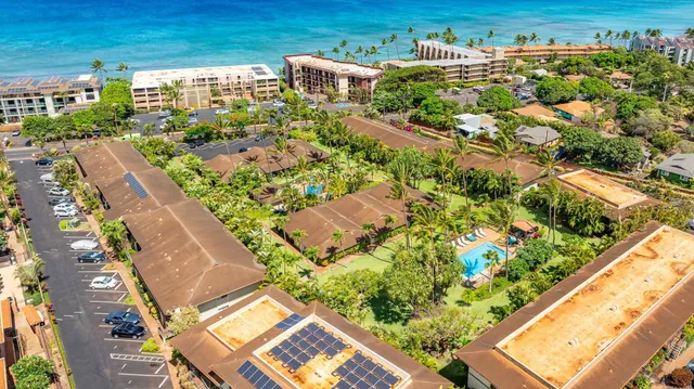 a view of a swimming pool with lounge chairs
