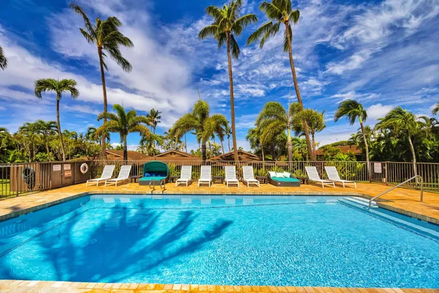a view of a swimming pool with a patio