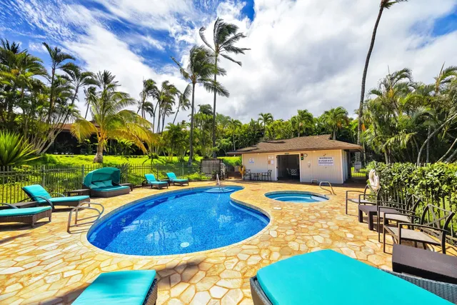 a view of a backyard with sitting area