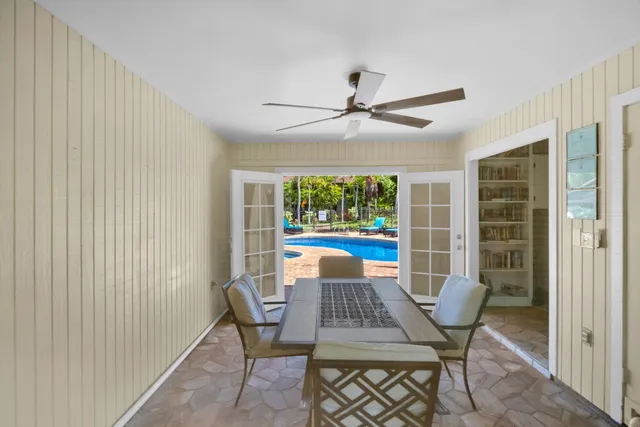 a backyard of a house with a yard and outdoor seating