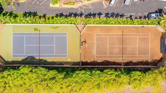 a view of a street with a car parked