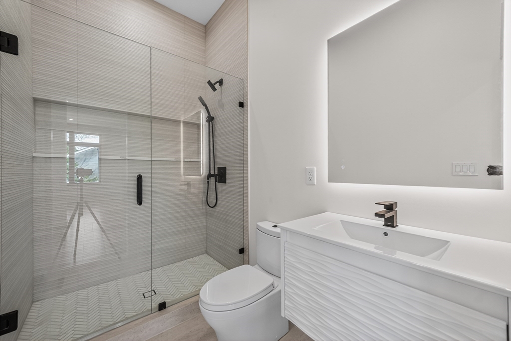 15 Bird Hill Road Lexington, MA 02421 - Photo 18 of 34 a bathroom with a sink toilet and shower