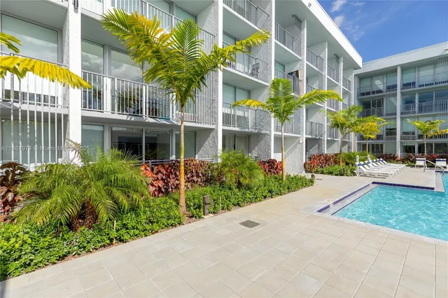 a view of a building with a yard