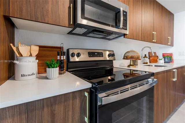 a kitchen with a stove and a microwave