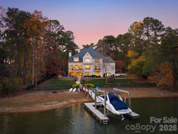 a view of house with outdoor space and lake view