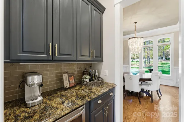a kitchen with a sink and wooden cabinets