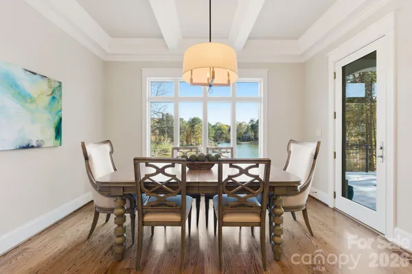 a view of kitchen and dining room with wooden floor