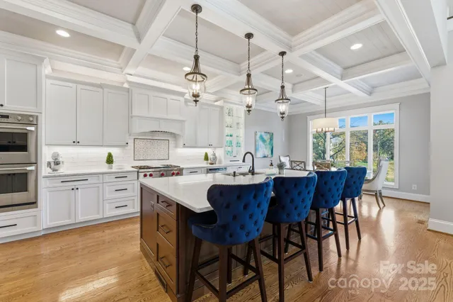 a large kitchen with a table and chairs